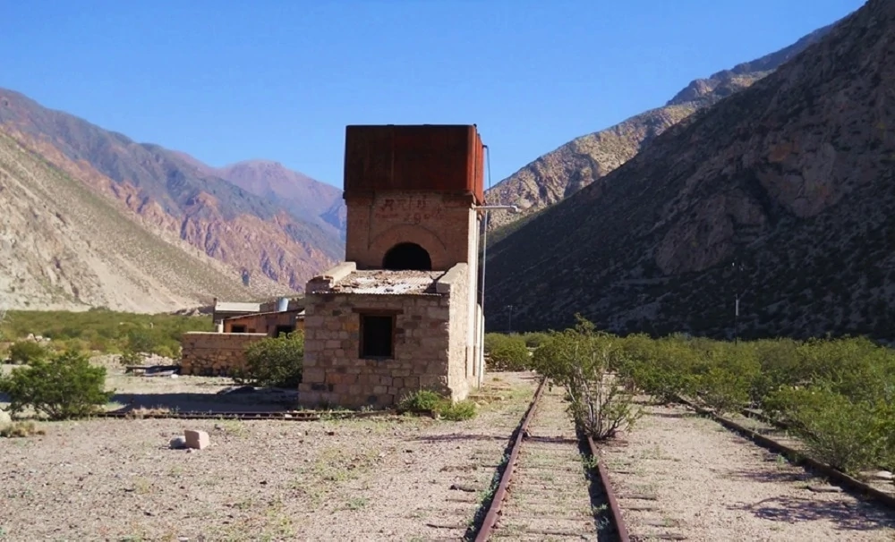 Valley with railroad and brick bilding